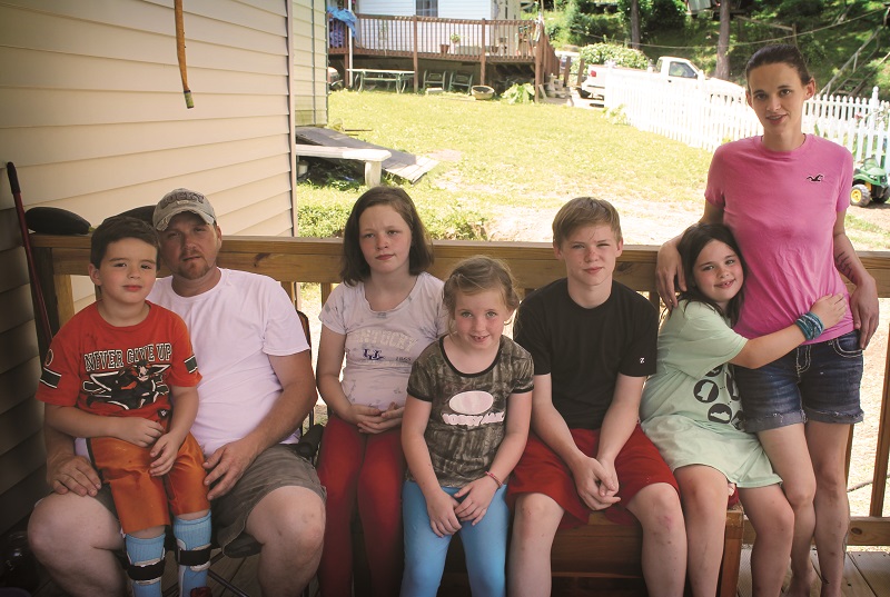 Tina, Robert, and five of their six children.