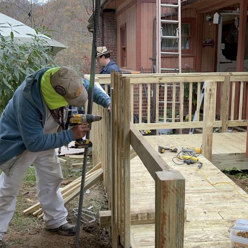 CAP volunteers make repairs to the 100th home following 2022 floods.